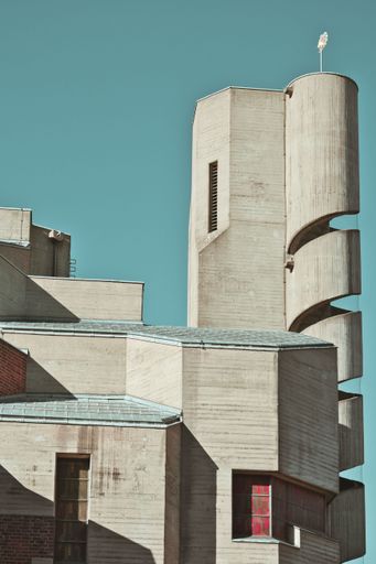 The Christi Auferstehung church tower with spiral staircase on blue sky background in Cologne, Germany