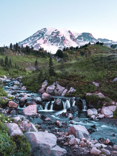 A wide view of Mount Rainier with snowy peaks at Rainer National Park.