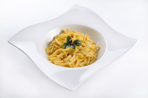 An isolated shot of pasta penne with cheese - perfect for a food blog or menu usage