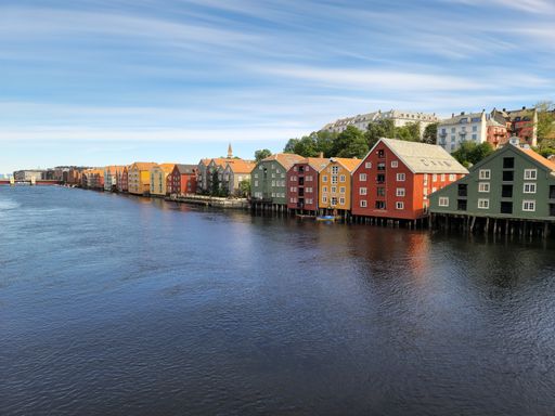 A beautiful shot of colorful houses on the shore of River Nidelva in Trondheim, Norway