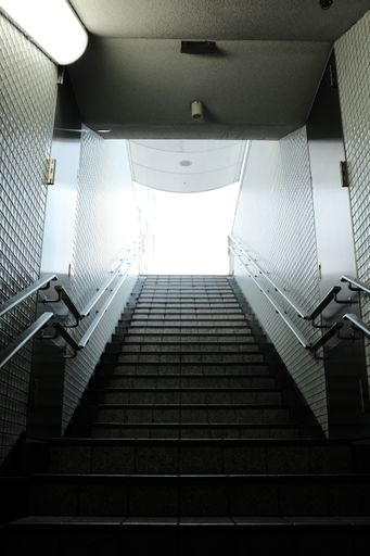 A vertical shot of stairs leading to an upper floor