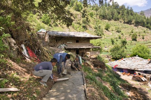 The villagers paving a path in a remote mountain village