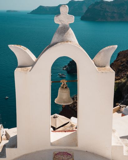 The traditional white bell tower at Santorini in Greece