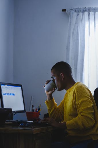 A man sitting in his room and working from home
