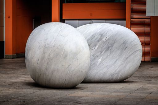 A decorative big marble stone pair on the ground in downtown Sydney