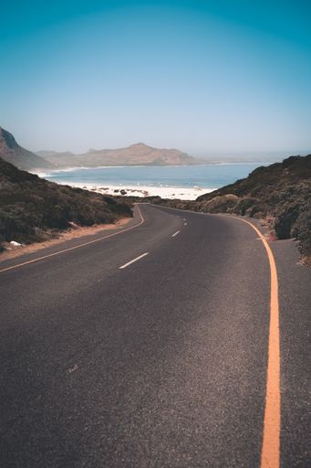 A vertical shot of a winding road leading to Whitesands beach in western Cape, South Africa