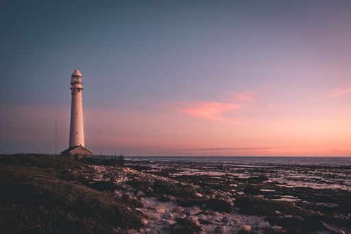The Slangkop Lighthouse over a background of a beautiful sunset