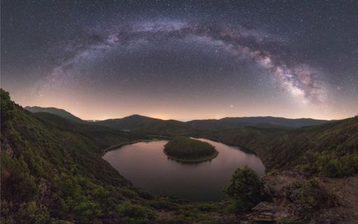 A stunning shot of the Melero Meander landscape with the galaxy visible in the sky - located in Caceres, Spain