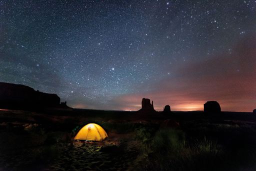 A camping area in the mountains in Arizona under the starry sky