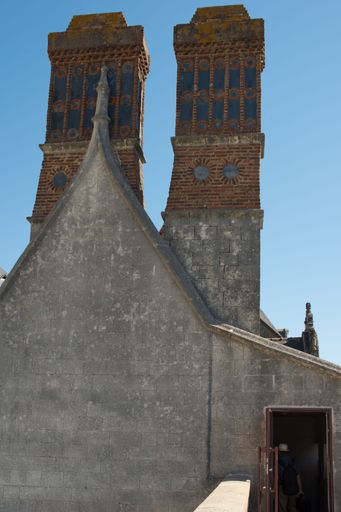 A vertical shot of the two towers on the rooftop of the Castle of the Dukes of Brittany in Nantes France