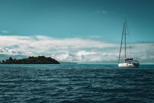 A boat sailing into the calm waters of Bora Bora, French Polynesia, an island in the Pacific