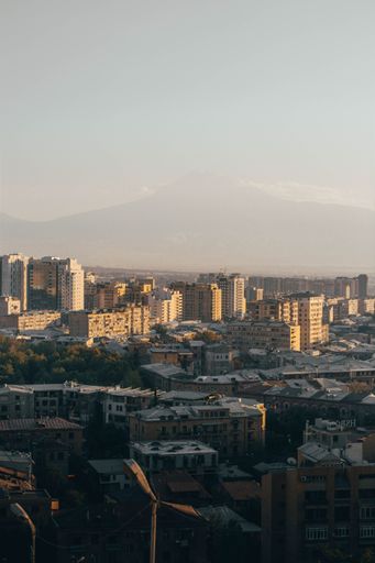 A vertical shot of downtown Yerevan cityscape with Mount Ararat in the background