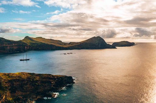 A mascmerasing aerial view of wild beach and cliffs at Ponta de Sao Lourenco, Portugal on cloudy day