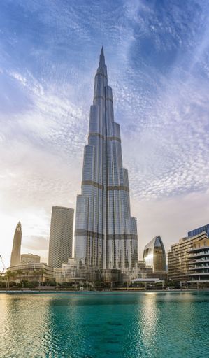 A vertical low angle shot of the famous Burj Khalifa building in Dubai on a sunny day