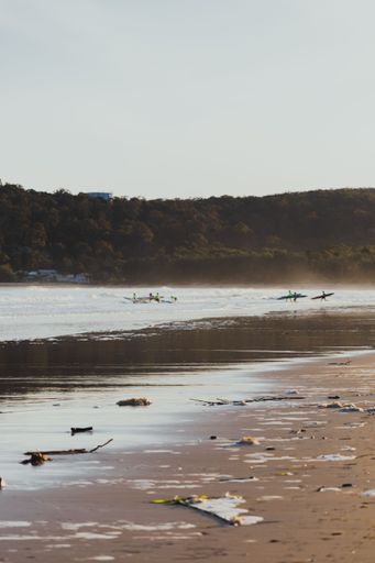 Wide Shot Of Female Surfers Competing Against Each Other In A Surf Contest