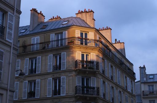 A low angle shot of a beautiful building shining under the natural sunny glow