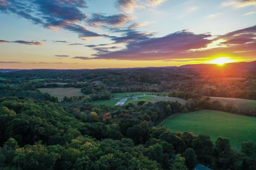 An aerial view of a beautiful sunset sky over a rural field in Sussex County, NJ