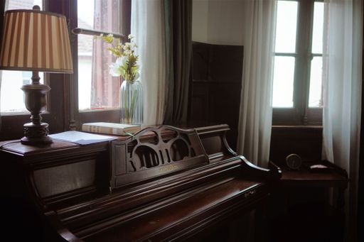 A piano in front of the windows
