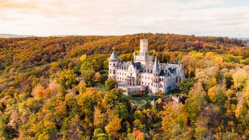 An aerial shot of Marienburg castle in Germany in autumn at sunset