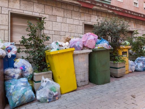 Overflowing trash bins in Italy. Concept The garbage problem. Caserta, Italy, January 09th 2023