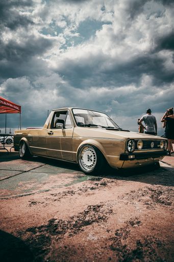 A vertical shot of an old vintage Volkswagen Golf car during the JDM fest in Montreal