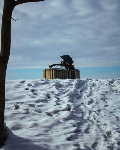 A vertical view of a Serbian memorial canon from WWI during winter