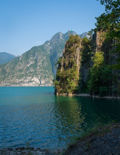 A vertical shot of mountains and Lake Iseo from Riva di Solto in Bergamo, Italy