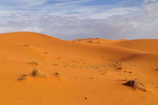 The Sahara Desert in Morocco under a cloudy sky