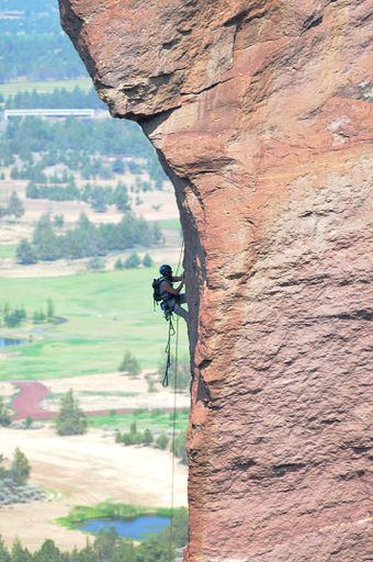 A vertical shot of a climber in Monkey Face, Smith Rock State Park, Redmond Oregon