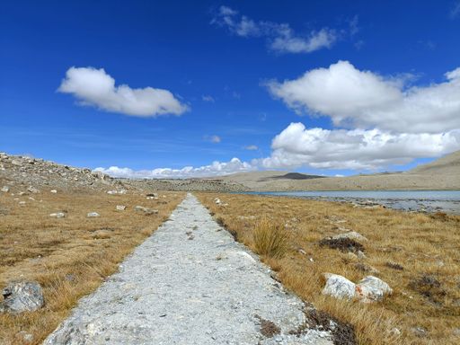 A pathway through the dry valley on a sunny day