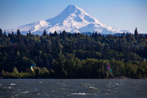 The kite surfers on the Columbia River with Mount Hood in the distance. Oregon, USA.