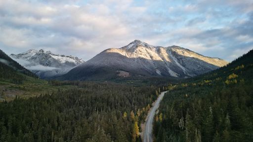 The mountains and green high trees in Joffre Lakes Provincial Park, British Columbia, Canada