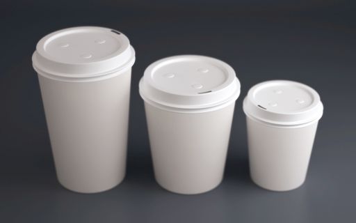 A high angle shot of three white cups of different sizes of delicious  warm coffee