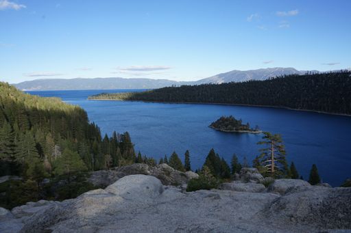 A landscape view of the fir forest trees around South Lake Tahoe with hills in the background