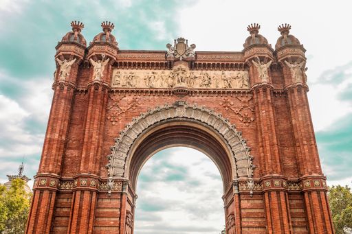A low angle shot of the ancient historic Arc de Triomf triumphal arc in Catalonia, Spain