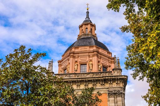 A low angle shot of an ancient historic building under the cloudy sky of Spain