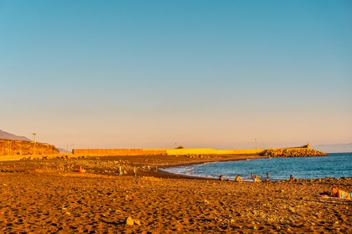 A sunset on the beach of Puerto de Tazacorte on the island of La Palma, Canary Islands, Spain