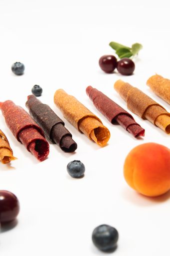 Berries and fruits, cherries, apricots, cherry plums, bog whortleberry. Pastila sweet snack without sugar.