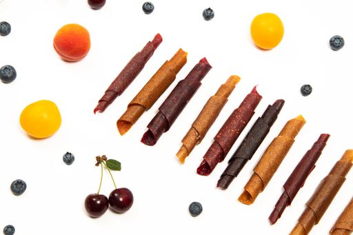 Berries and fruits, cherries, apricots, cherry plums, bog whortleberry. Pastila sweet snack without sugar.