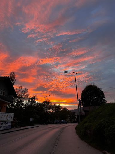 A street of a small town at sunset, vertical
