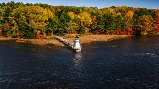 A beautiful shot of Doubling Point Lighthouse on Kennebec River in Bath, Maine on sunny day in late spring.