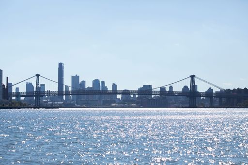 A view of the Brooklyn bridge and Manhattan from the water in New York City, United States.