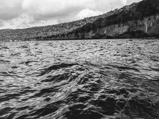 A mesmerizing shot of a seascape during the day in grayscale