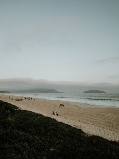 Beautiful landscape shot of the beach in Rio de Janeiro during a cloudy dark day.