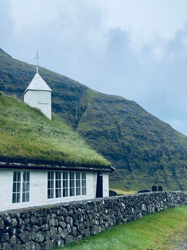 A vertical shot of a church in Saksun, Faroe Islands