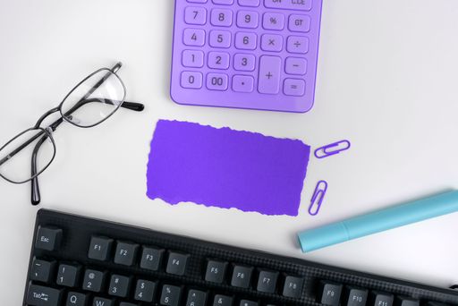 Office Supplies Over Desk With Keyboard And Glasses And Coffee Cup For Working