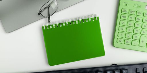 Office Supplies Over Desk With Keyboard And Glasses And Coffee Cup For Working