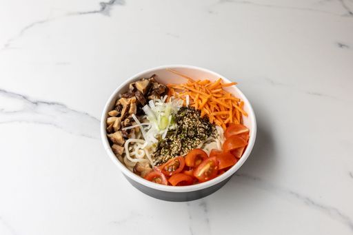 A tasty poke bowl with mushrooms on the marble table