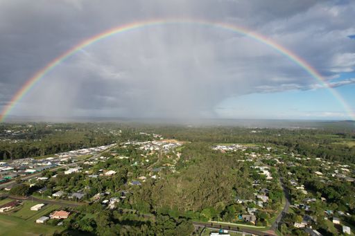 A scenic shot of a rainbow over the town
