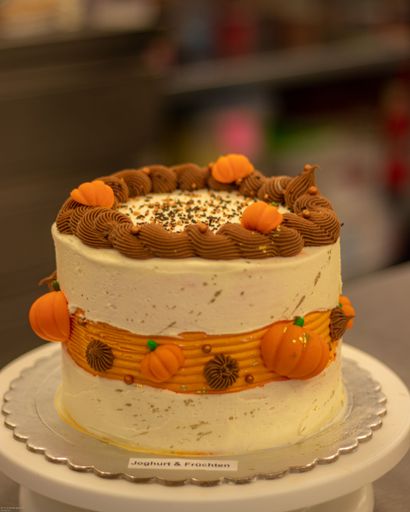 A closeup of a delicious funny decorated cake on a table at a Halloween party
